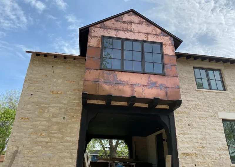 Copper metal panel facade on a stone building for Metal Roof Coating in St. Louis